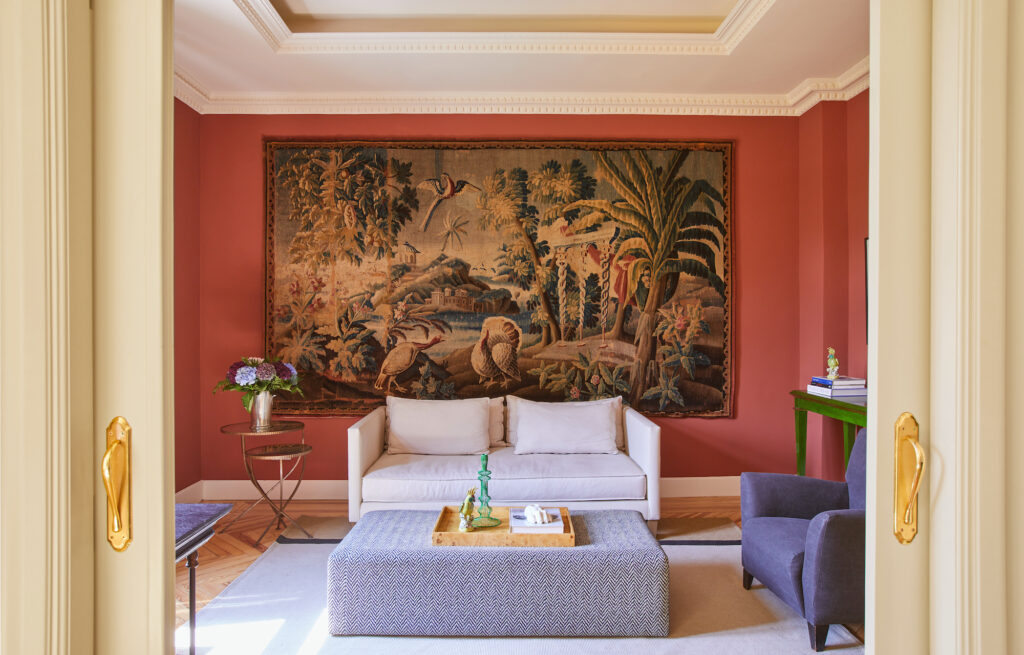 A piece of history found its rightful place in the modern interior of the apartment when a eighteenth-century tapestry, once owned by the owner's grandfather, adorns one of the living room walls. 